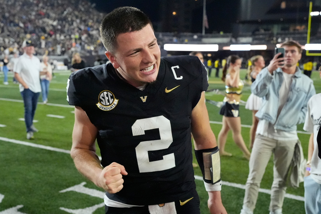 Vanderbilt quarterback Diego Pavia (2) celebrates the team's overtime win after an NCAA college football game against Auburn, Saturday, Nov. 8, 2025, in Nashville, Tenn. (AP Photo/George Walker IV)