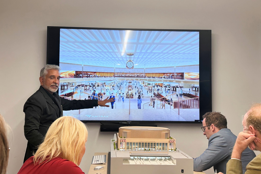 Vishaan Chakrabarti, one of the leaders of the team awarded the project to dramatically redesign New York City's Penn Station, presents architectural designs during a presentation Monday, June 8, 2026, in New York. (AP Photo/Philip Marcelo)