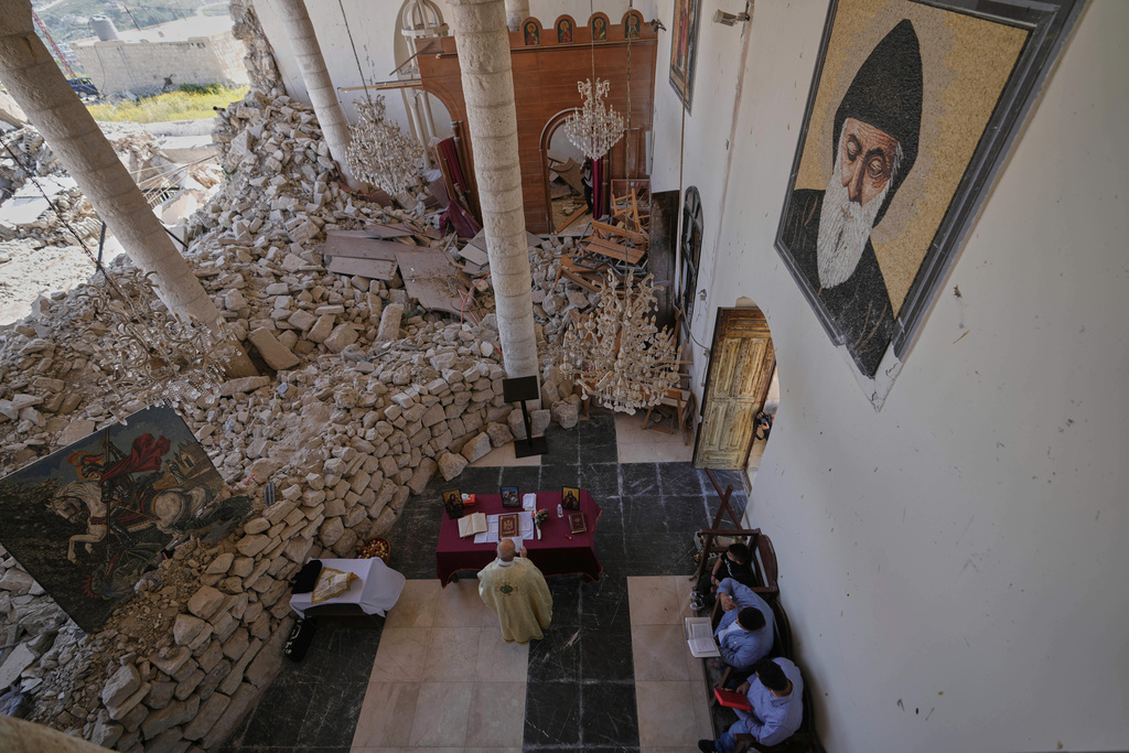 Worshippers gather for Easter Mass inside the ruins of St. George Melkite Catholic Church, damaged by Israeli airstrike, in Dardghaya, southern Lebanon, April 20, 2025. (AP Photo/Hassan Ammar, File)