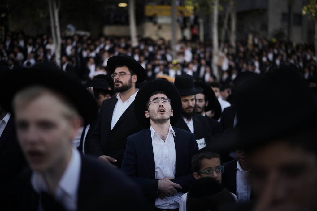 Ultra-Orthodox Jewish men attend a rally against plans to force them to serve in the Israeli military, in Jerusalem, Thursday, Oct. 30, 2025. (AP Photo/Leo Correa)