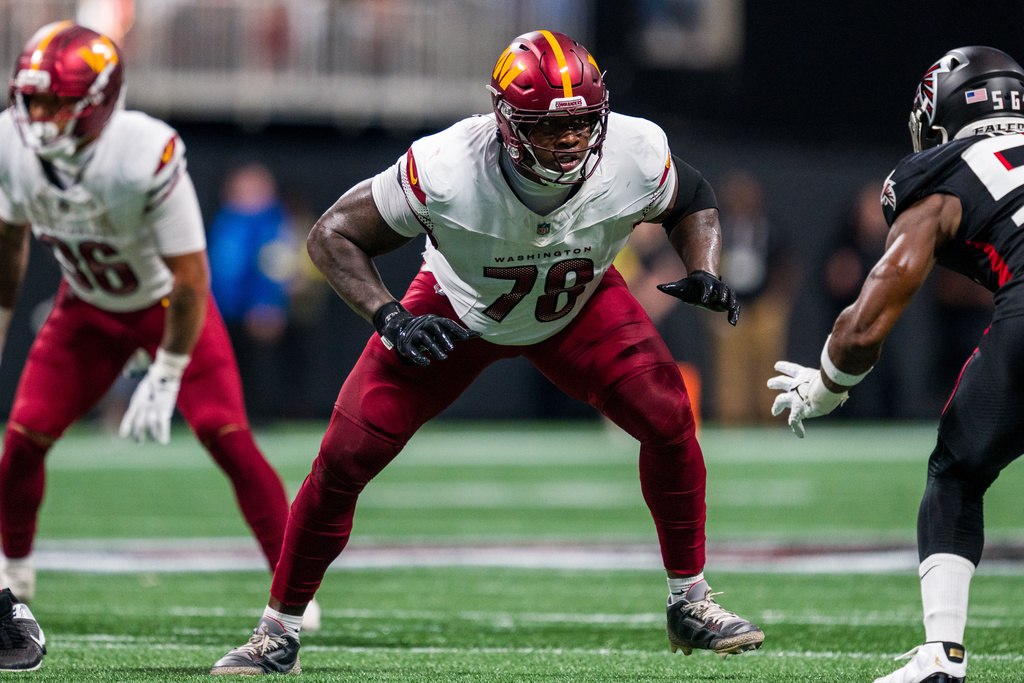 FILE - Washington Commanders offensive tackle Laremy Tunsil (78) works during the second half of an NFL football game against the Atlanta Falcons, Sep. 28, 2025, in Atlanta. (AP Photo/Danny Karnik, File)