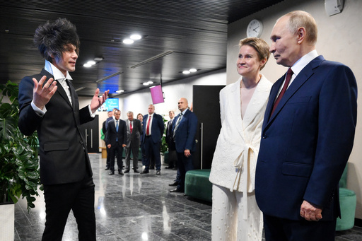 Russian President Vladimir Putin, right, accompanied by Board Chairwoman of the Sirius Federal Territory and Head of the Talent and Success Foundation Elena Shmeleva, listens to Chief Architect Andrei Litvinov, left, during a visit to the newly opened Sirius Concert Centre of the Sirius Federal Territory, Krasnodar Region, Russia, Friday, Oct. 3, 2025. (Grigory Sysoyev, Sputnik, Kremlin Pool Photo via AP) Russian President Vladimir Putin, right, accompanied by Board Chairwoman of the Sirius Federal Territory and Head of the Talent and Success Foundation Elena Shmeleva, listens to Chief Architect Andrei Litvinov, left, during a visit to the newly opened Sirius Concert Centre of the Sirius Federal Territory, Krasnodar Region, Russia, Friday, Oct. 3, 2025. (Grigory Sysoyev, Sputnik, Kremlin Pool Photo via AP)
