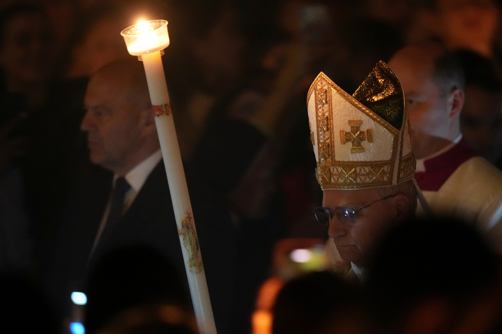 Pope Leo XIV arrives for the Easter Vigil inside St. Peter's Basilica at The Vatican, Saturday, April 4, 2026. (AP Photo/Andrew Medichini)