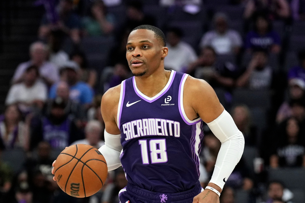 FILE - Sacramento Kings guard Russell Westbrook (18) dribbles the ball during the second half of an NBA basketball game against the Philadelphia 76ers, Thursday, March 19, 2026, in Sacramento, Calif. (AP Photo/Justine Willard,File)