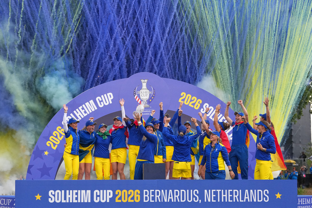 Anna Nordqvist, Europe team captain, holds the trophy aloft after her team won the Solheim Cup in Den Bosch, Netherlands, Sunday, Sept. 13, 2026. (AP Photo/Alastair Grant)