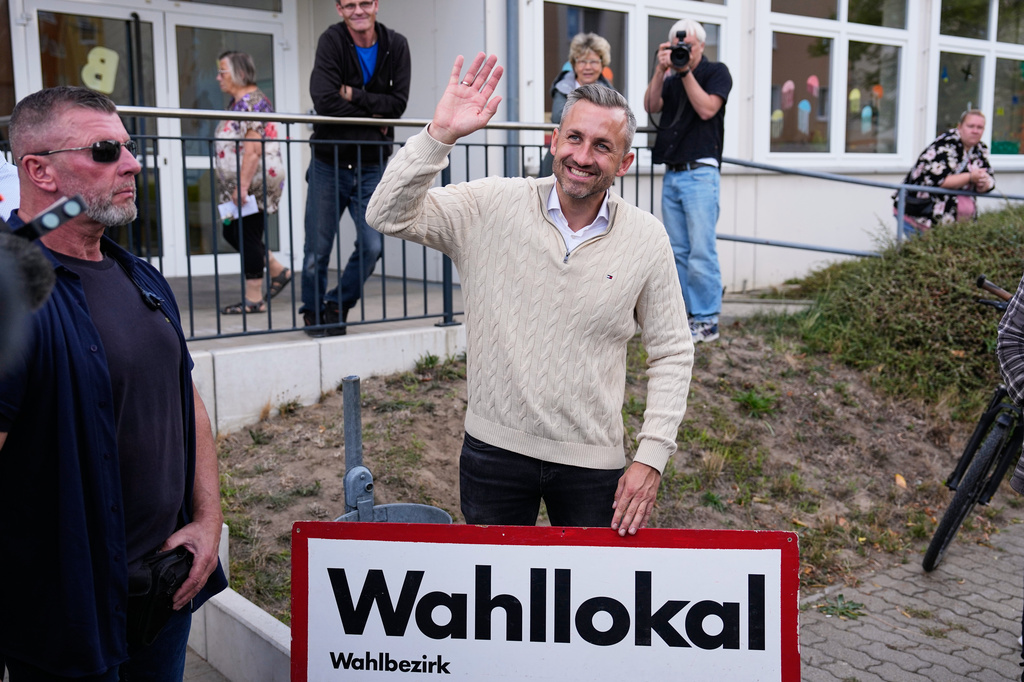 Ulrich Siegmund, top candidate for the "Alternative for Germany" (AfD) party waves to supporters at a polling station after voting during the Saxony-Anhalt state elections in Tangermuende, eastern Germany, Sunday, Sept. 6, 2026. (AP Photo/Matthias Schrader)