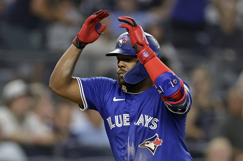 Toronto Blue Jays' Vladimir Guerrero Jr. reacts after hitting a home run during the fifth inning of a baseball game against the New York Yankees, Friday, Sept. 5, 2025, in New York. (AP Photo/Adam Hunger)