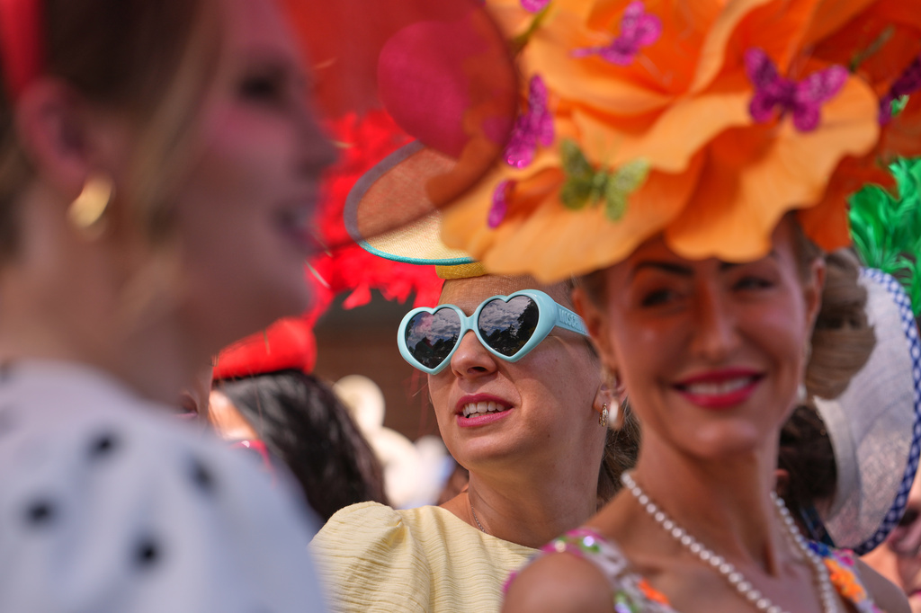 Racegoers queue at the entrance as they arrive on the first day of the Royal Ascot horse race meeting in Ascot, England, Tuesday, June 16, 2026.(AP Photo/Kin Cheung)