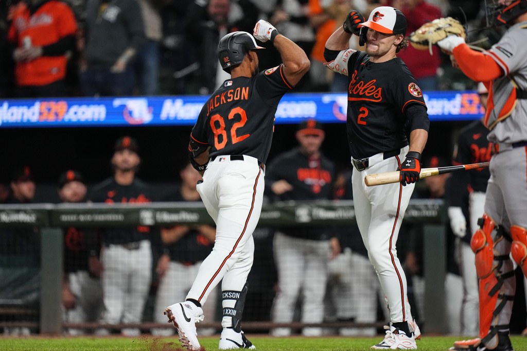 Baltimore Orioles' Jeremiah Jackson (82) celebrates with Gunnar Henderson (2) after hitting a home run during the seventh inning of a baseball game against the San Francisco Giants, Saturday, April 11, 2026, in Baltimore. (AP Photo/Stephanie Scarbrough)