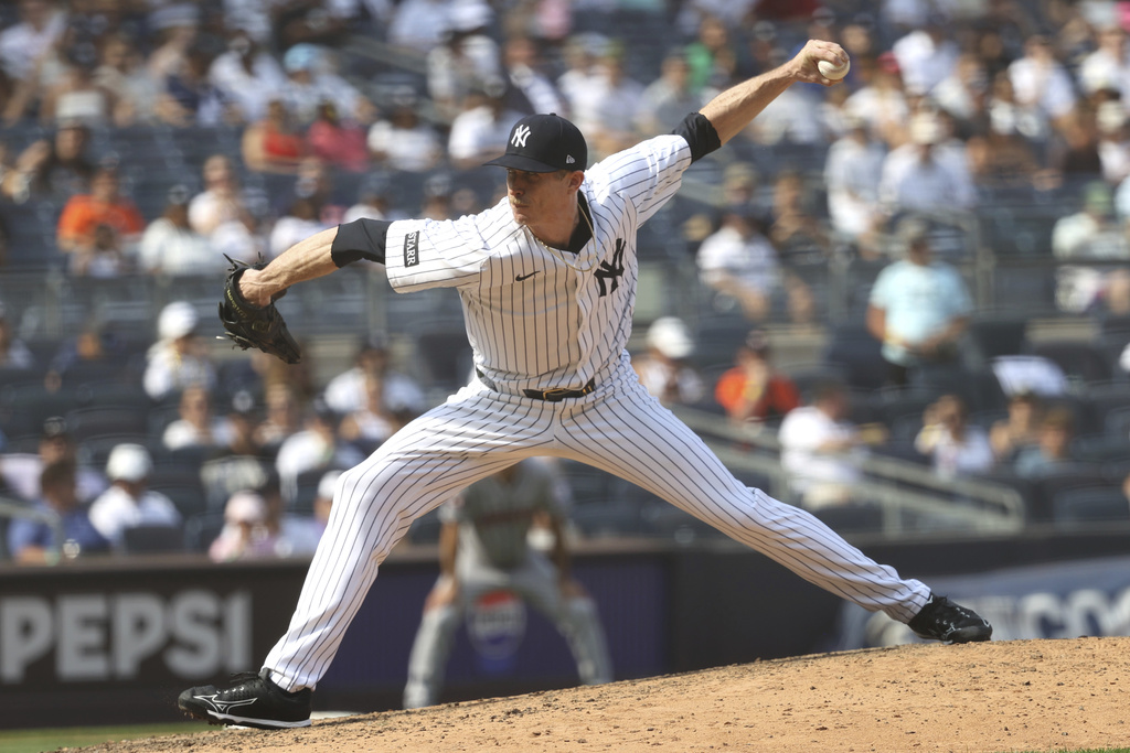 New York Yankees pitcher Tim Hill throws during the ninth inning of a baseball game against the Houston Astros, Sunday, Aug. 10, 2025, in New York. (AP Photo/Pamela Smith)