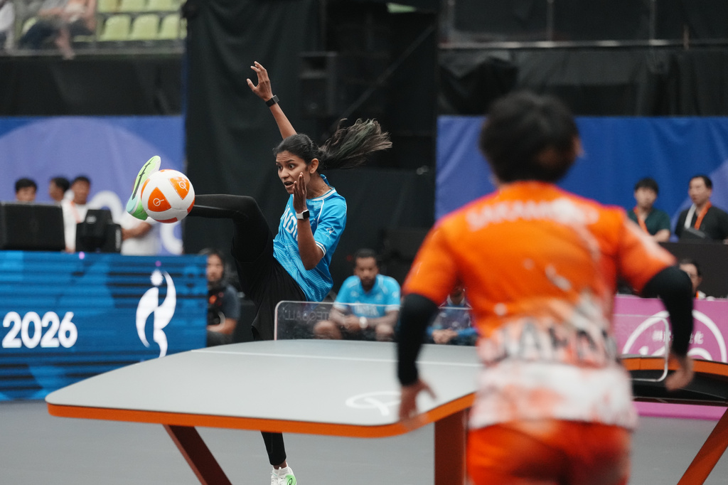 India's Quimcy Joaquim Dsouza controls the ball during the women's singles bronze-medal teqball match against Japan's Yuina Sakamoto at the 20th Asian Games in Nagoya, Japan, Sunday, Sept. 20, 2026. (AP Photo/Lee Jin-man)