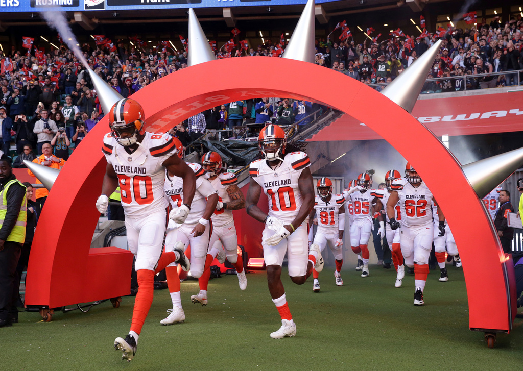FILE - Cleveland Browns players run onto the field before an NFL football game against Minnesota Vikings at Twickenham Stadium in London, Oct. 29, 2017. (AP Photo/Matt Dunham, File)