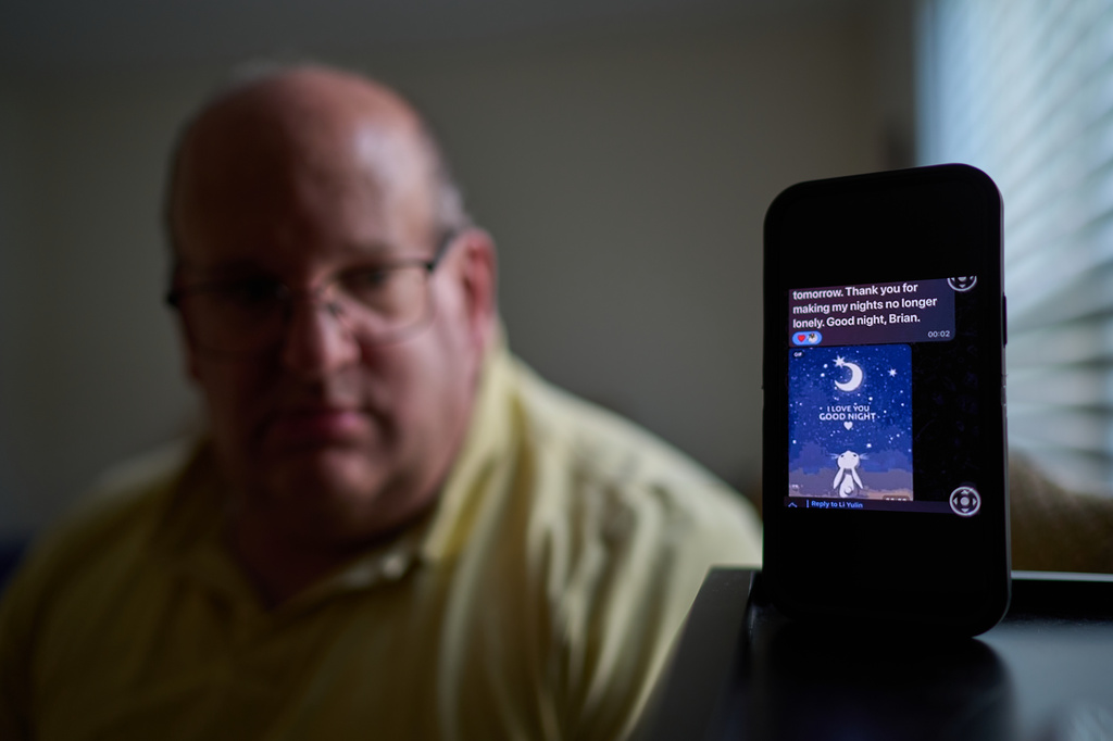 A text message from a scammer who stole $575,000 from Brian Glick is displayed on Glick's phone as he poses for a portrait at his home, Wednesday, June 25, 2025, in Ballston Lake, N.Y. (AP Photo/David Goldman)