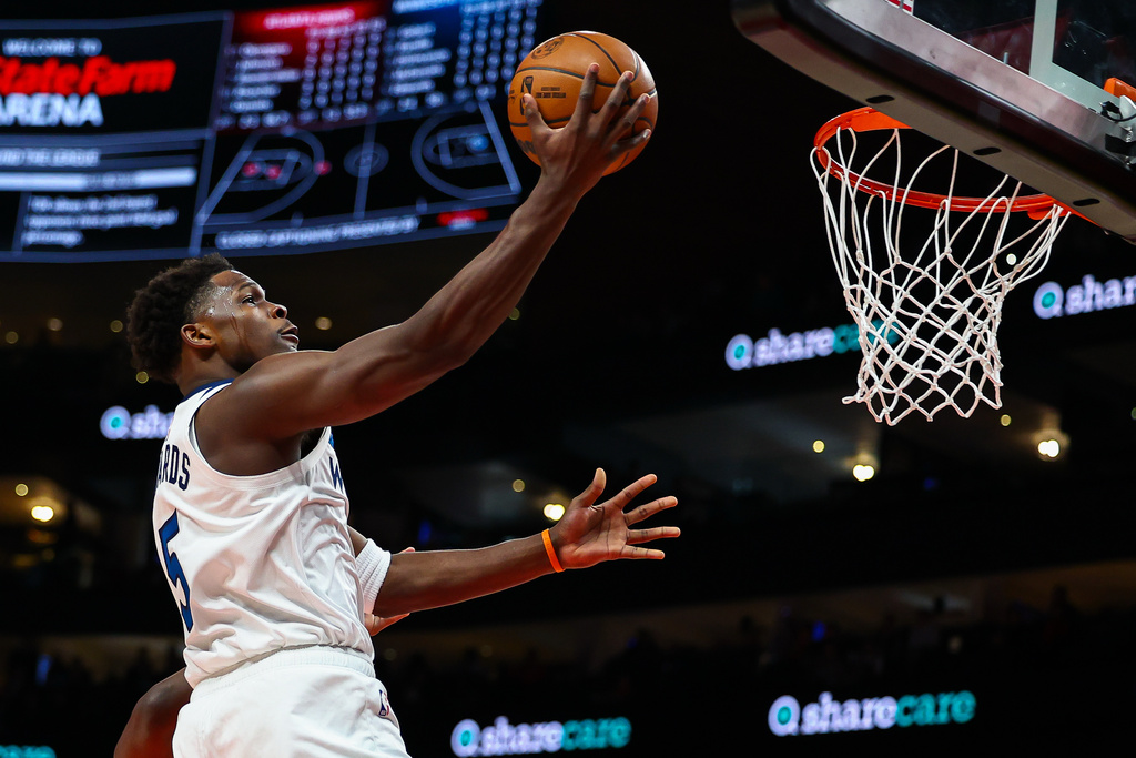 Minnesota Timberwolves guard Anthony Edwards (5) shoots during the first half of an NBA basketball game against the Atlanta Hawks, Wednesday, Dec. 31, 2025, in Atlanta. (AP Photo/Colin Hubbard)