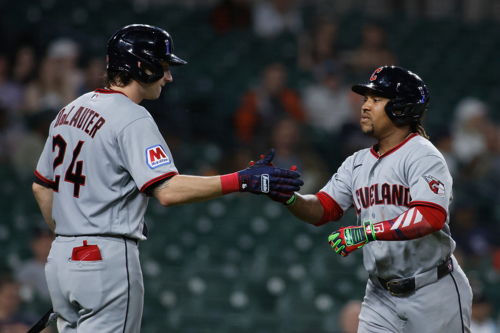 Cleveland Guardians' Jose Ramirez celebrates with Chase DeLauter (24) after hitting a solo home run against the Detroit Tigers during the ninth inning of a baseball game, Monday, May 18, 2026, in Detroit. (AP Photo/Duane Burleson)