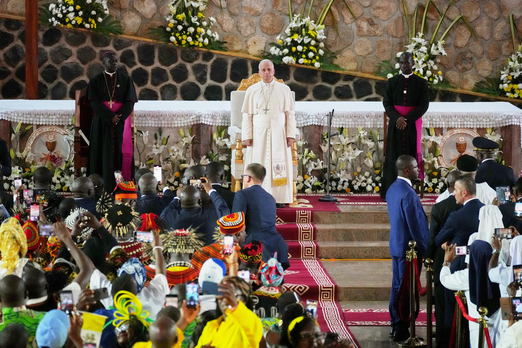 Pope Leo XIV, with the Archbishop of Bamenda Andrew Nkea Fuanya, left, leads a meeting for peace at Saint Joseph's Cathedral in Bamenda, Cameroon, with the local community Thursday, April 16, 2026, on the fourth day of his 11-day pastoral visit to Africa. (AP Photo/Andrew Medichini)