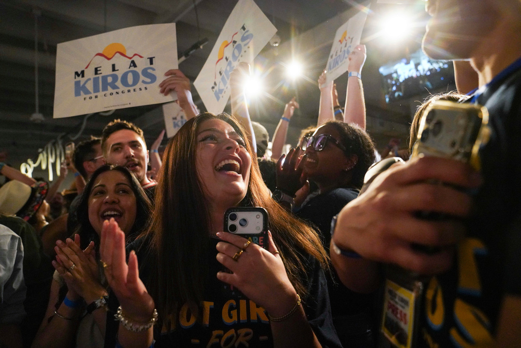 Attendees celebrate after Democratic congressional candidate Melat Kiros won the Democratic nomination during a primary election night watch party at The Broadway, Tuesday, June 30, 2026, in Denver. (AP Photo/Rebecca Slezak)