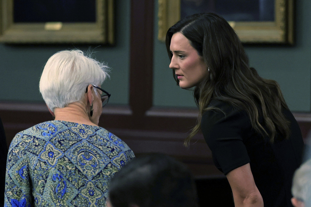 Kirsten Bridegan, widowed wife of Jared Bridegan, takes a seat during opening statements in the trial of Mario Fernandez Saldana at the Duval County Courthouse on Monday, Aug. 17, 2026, in Jacksonville, Fla. (Corey Perrine/The Florida Times-Union via AP, Pool)