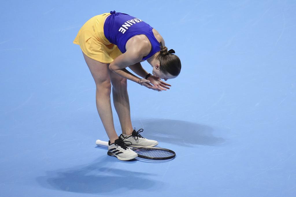 Elina Svitolina, of Ukraine reacts after losing a point to Jasmine Paolini, of Italy during the Billie Jean King Cup semifinals tennis match, at the Shenzhen Bay Sports Center Arena, in Shenzhen, China's Guangdong province, Friday, Sept. 19, 2025. (AP Photo/Andy Wong)