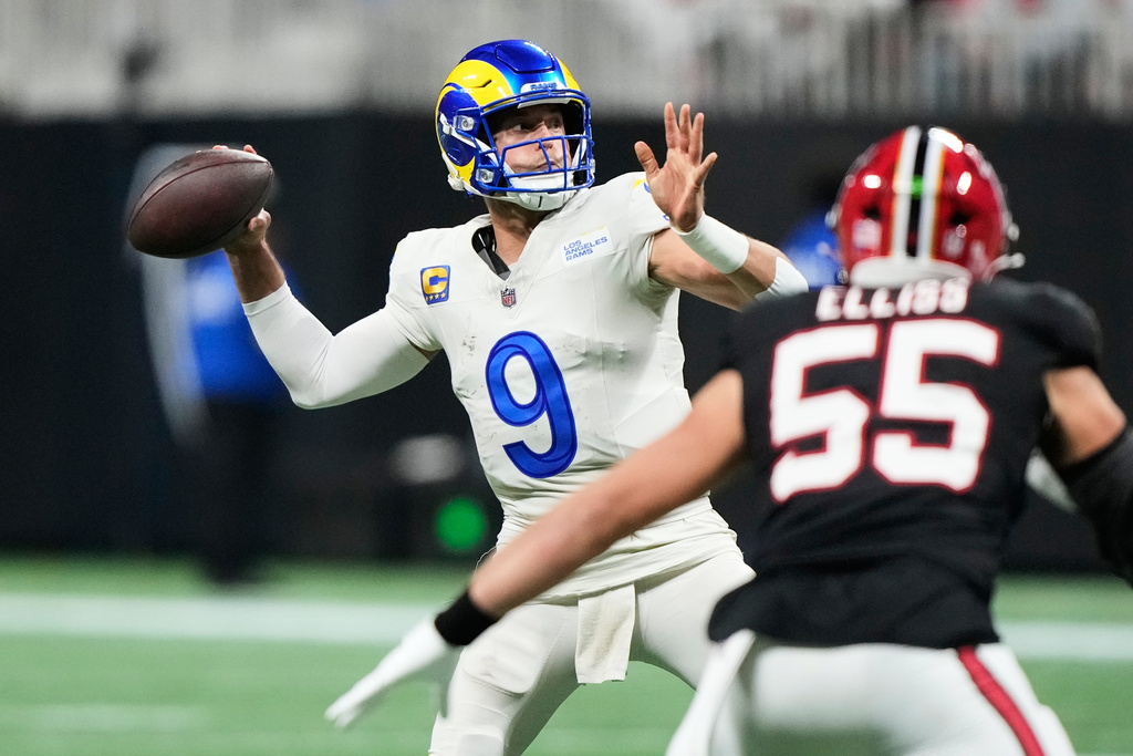 Los Angeles Rams quarterback Matthew Stafford (9) throws a touchdown pass in the second half of an NFL football game against the Atlanta Falcons, Monday, Dec. 29, 2025, in Atlanta. (AP Photo/Brynn Anderson)