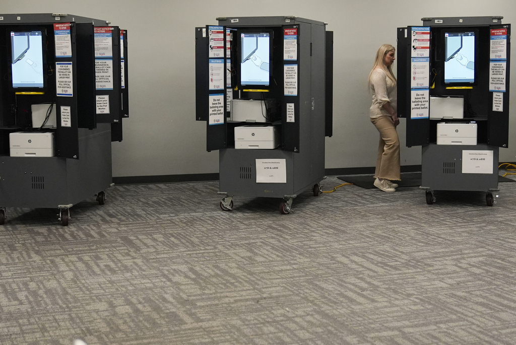 FILE - A person votes at a polling site for the presidential primary election March 12, 2024, in Atlanta. (AP Photo/Brynn Anderson, File)