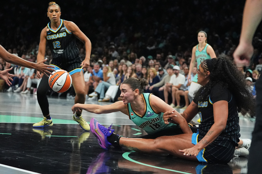 New York Liberty's Pauline Astier (18) fights for control of the ball with Chicago Sky's Kamilla Cardoso (10) during the second half of a WNBA basketball game Wednesday, July 22, 2026, in New York. (AP Photo/Frank Franklin II)