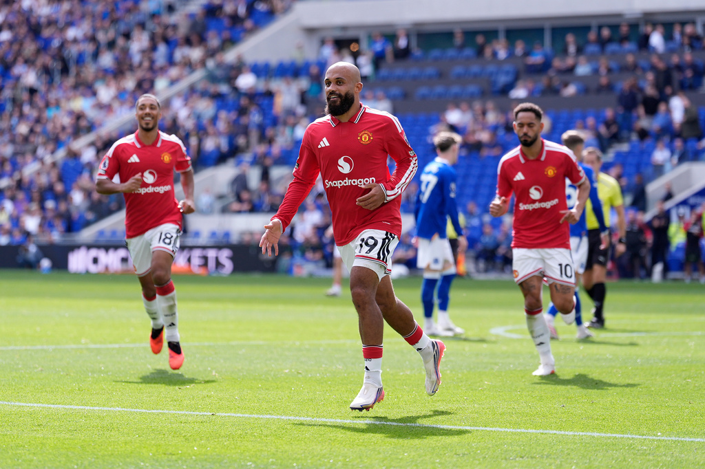Manchester United's Bryan Mbeumo celebrates scoring their side's first goal of the game during the English Premier League soccer match between Everton and Manchester United in Liverpool, England, Sunday, Sept. 6, 2026. (Peter Byrne/PA via AP)