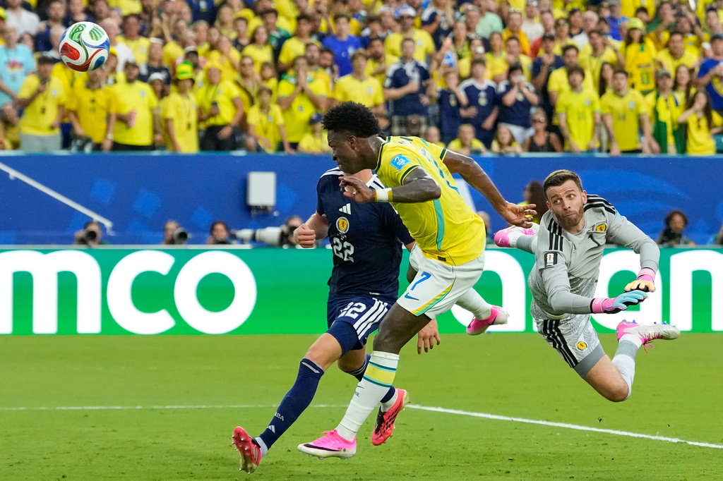 Brazil's Vinicius Junior (7) scores his team's second goal during the World Cup Group C soccer match between Scotland and Brazil in Miami Gardens, Fla., Wednesday, June 24, 2026. (AP Photo/Rebecca Blackwell)