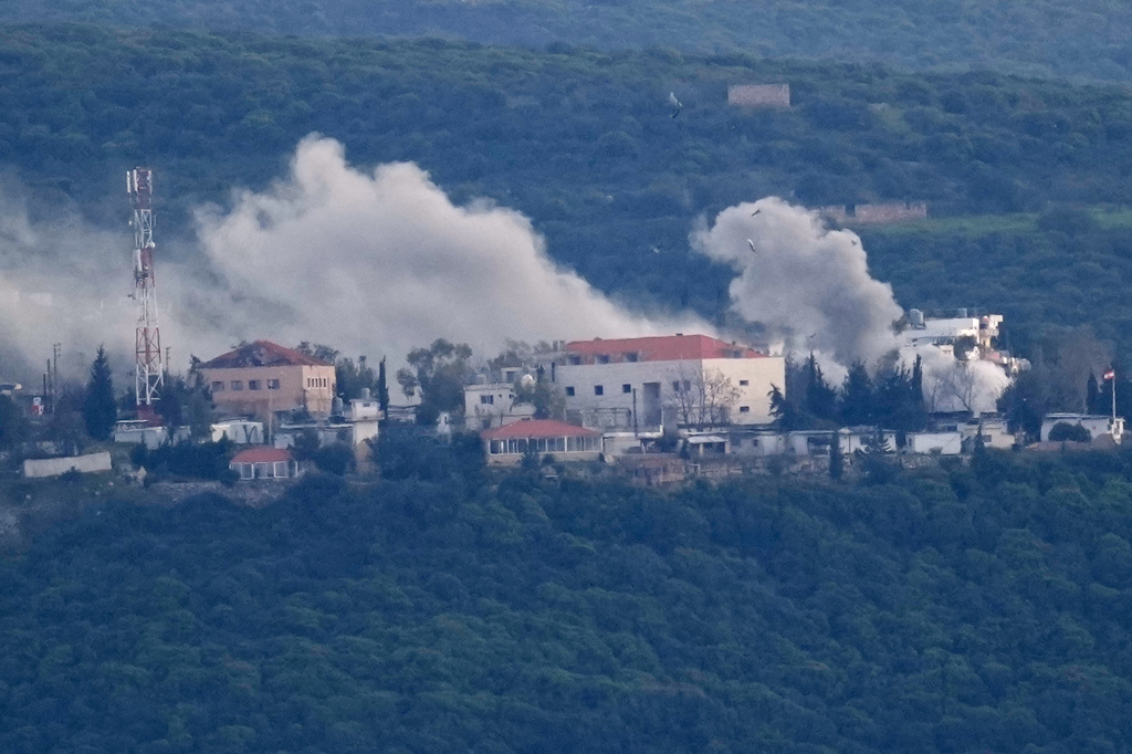 Smoke rises from Israeli artillery shelling on the village of Bayada as it is seen from Tyre city, south Lebanon, Thursday, March 26, 2026. (AP Photo/Hussein Malla)