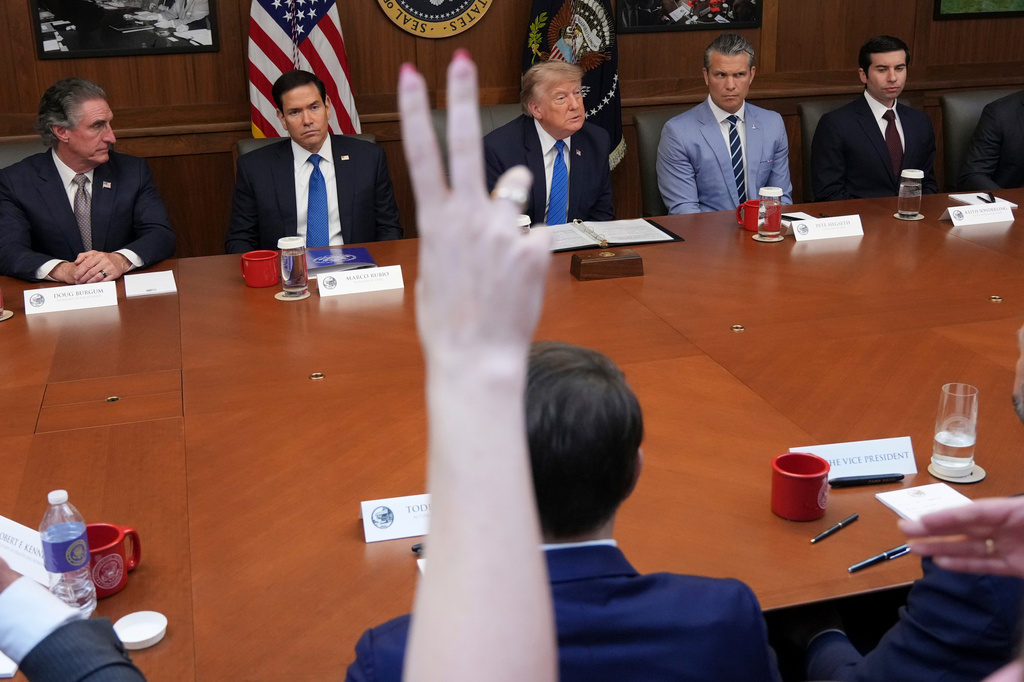 President Donald Trump, center, joined by Interior Secretary Doug Burgum, from left, Secretary of State Marco Rubio, Defense Secretary Pete Hegseth and acting Labor Secretary Keith Sonderling, listens as reporters raise their hands to ask a question during a cabinet meeting, Friday, July 31, 2026, at Camp David, the presidential retreat, near Thurmont, Md., Friday, July 31, 2026. (AP Photo/Jacquelyn Martin)
