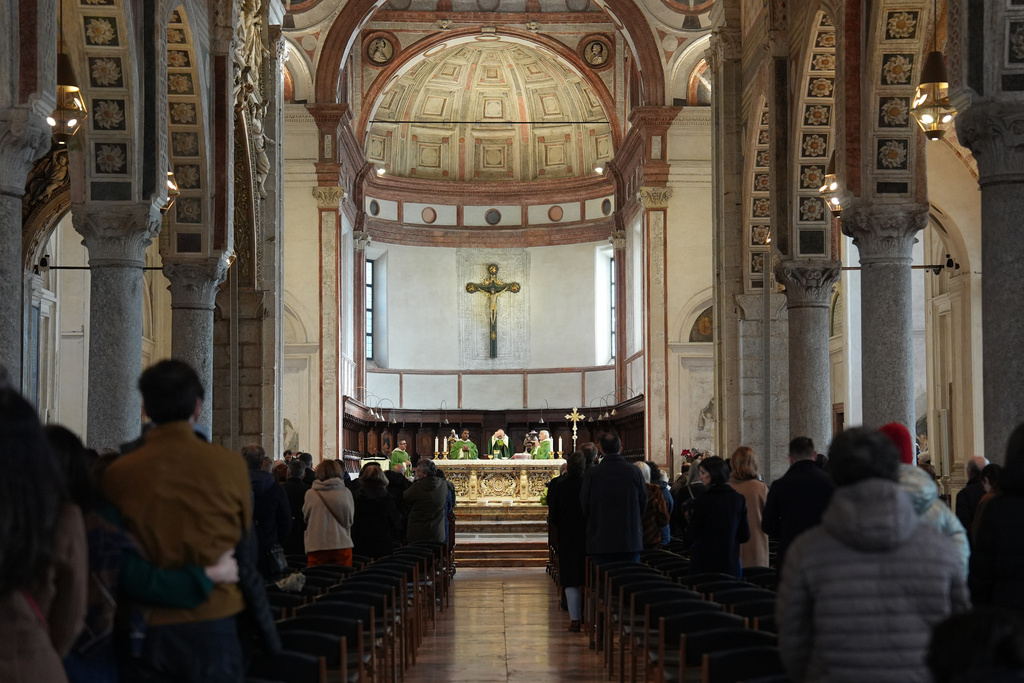 Worshippers attend Mass at the Basilica of Santa Maria delle Grazie, best known as the home of Leonardo da Vinci's "The Last Supper," in Milan, Italy, Sunday, Feb. 15, 2026. (AP Photo/María Teresa Hernández)