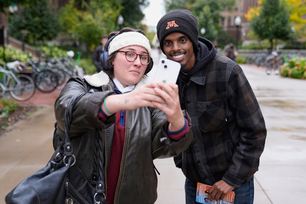 Minneapolis Mayoral candidate Omar Fateh takes a selfie with a supporter at University of Minnesota, Tuesday, Oct. 21, 2025, in Minneapolis. (AP Photo/Abbie Parr)