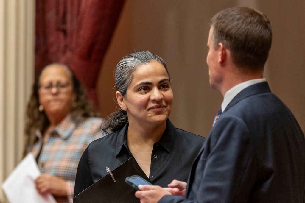 D-Calif. State Sen. Aisha Wahab stands with a colleague at the state legislature on Monday, June 15, 2026 in Sacramento, Calif. (AP Photo/Annie Barker)