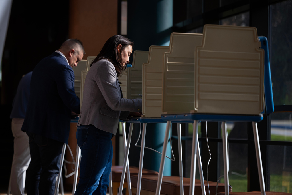 Denise Powell, candidate for the Democratic nomination to the House of Representatives in Nebraska's second district, votes in the Nebraska Primary Election at Omaha Community Playhouse Tuesday, May 12, 2026, in Omaha, Neb. (AP Photo/Rebecca S. Gratz)
