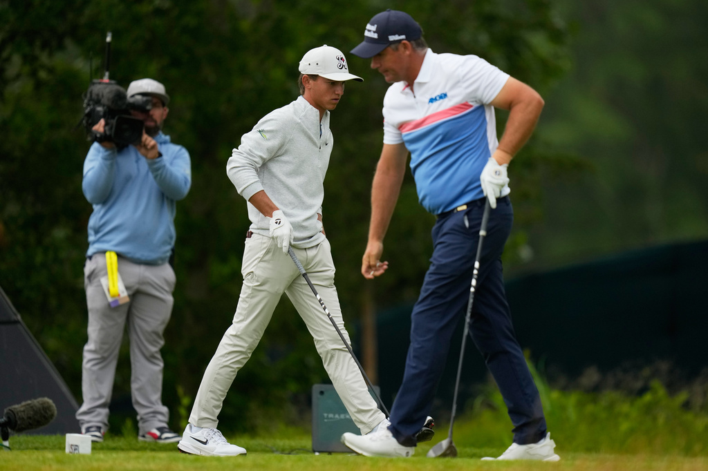 Miles Russell and Padraig Harrington, of Ireland, on the tee on the third hole during the first round of the U.S. Open golf tournament at Shinnecock Hills Golf Club in Southampton, N.Y., Thursday, June 18, 2026.(AP Photo/Seth Wenig)