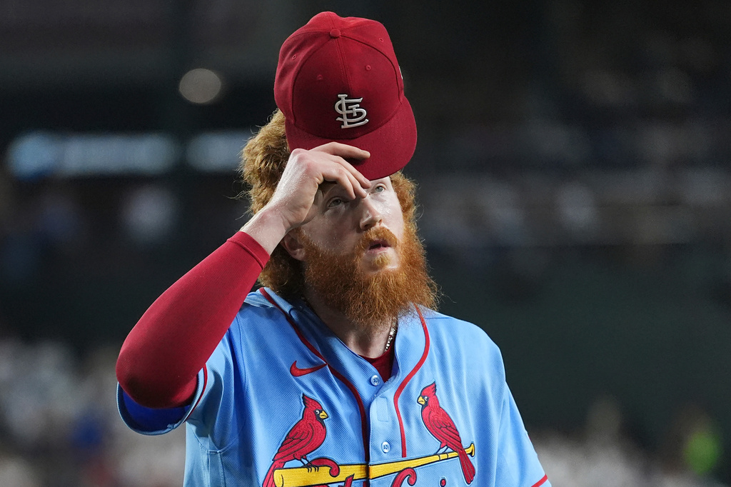 St. Louis Cardinals starting pitcher Dustin May walks off the field after retiring the Arizona Diamondbacks during the third inning of a baseball game, Saturday, July 18, 2026, in Phoenix. (AP Photo/Ross D. Franklin)