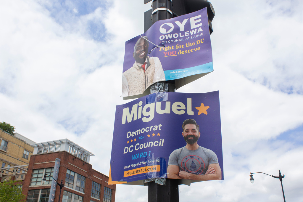 Campaign signs are posted in the U Street Corridor of Washington, Sunday, June 7, 2026. (AP Photo/Tallulah Brown Van Zee)