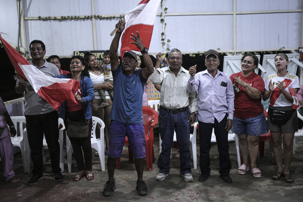 Residents attend a local news program to speak in defense of their land in Santa Rosa, Peru, an island on the Amazon River at the center of a territorial dispute with Colombia, Sunday, Aug. 17, 2025. (AP Photo/Ivan Valencia)