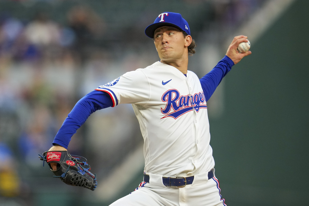 Texas Rangers starting pitcher Jacob Latz throws against the Milwaukee Brewers during the first inning of a baseball game Monday, Sept. 8, 2025, in Arlington, Texas. (AP Photo/Julio Cortez)