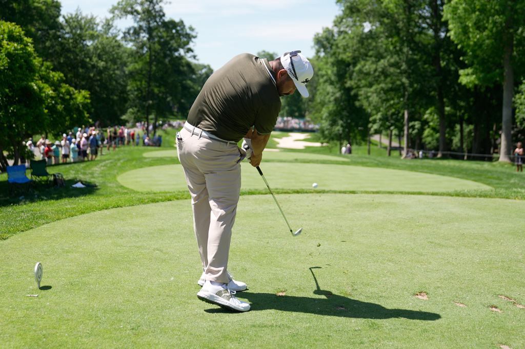 J.J. Spaun, of the United States, hits from the eighth tee during the first round of the Memorial golf tournament in Dublin, Ohio, Thursday, June 4, 2026. (AP Photo/Sue Ogrocki)