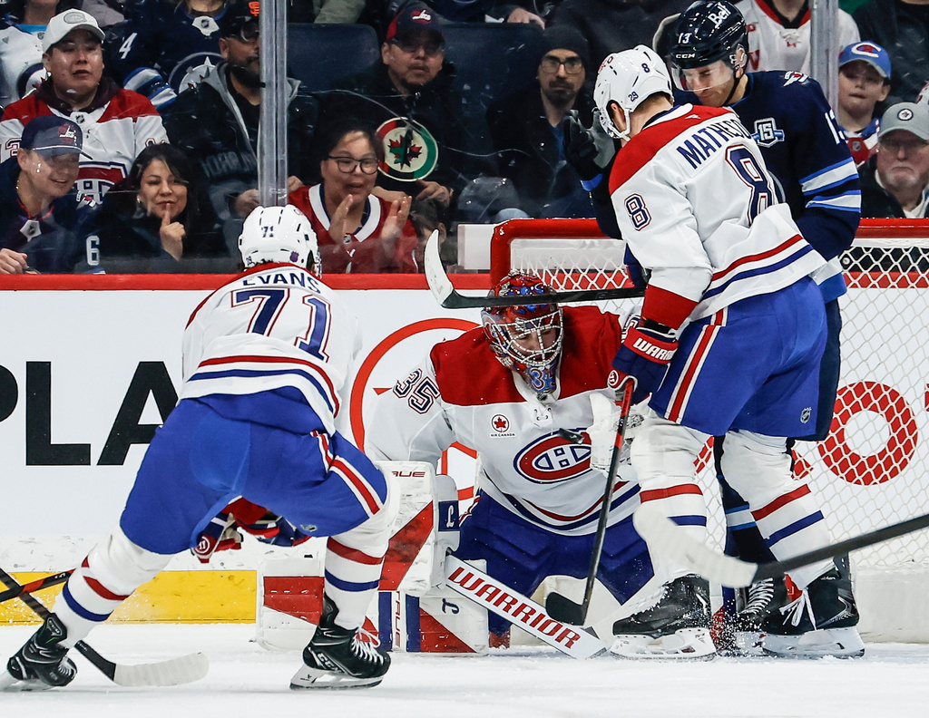 Montreal Canadiens goaltender Samuel Montembeault saves the Winnipeg Jets shot during the first period of an NHL hockey game in Winnipeg, Manitoba, Wednesday, Feb. 4, 2026. (John Woods/The Canadian Press via AP)