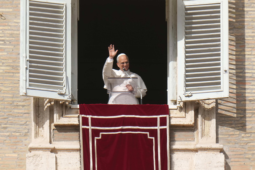 Pope Leo XIV delivers his blessing as he recites the Angelus noon prayer from the window of his studio overlooking St.Peter's Square, at the Vatican, Sunday, Oct. 26, 2025. (AP Photo/Alessandra Tarantino) Pope Leo XIV delivers his blessing as he recites the Angelus noon prayer from the window of his studio overlooking St.Peter's Square, at the Vatican, Sunday, Oct. 26, 2025. (AP Photo/Alessandra Tarantino)