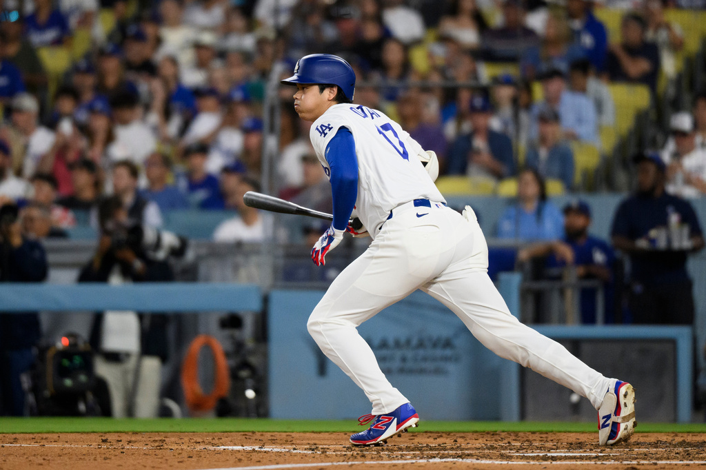 Los Angeles Dodgers' Shohei Ohtani runs after hitting a two-run single during the fourth inning of a baseball game against the Colorado Rockies in Los Angeles, Monday, July 6, 2026. (AP Photo/Kyusung Gong)