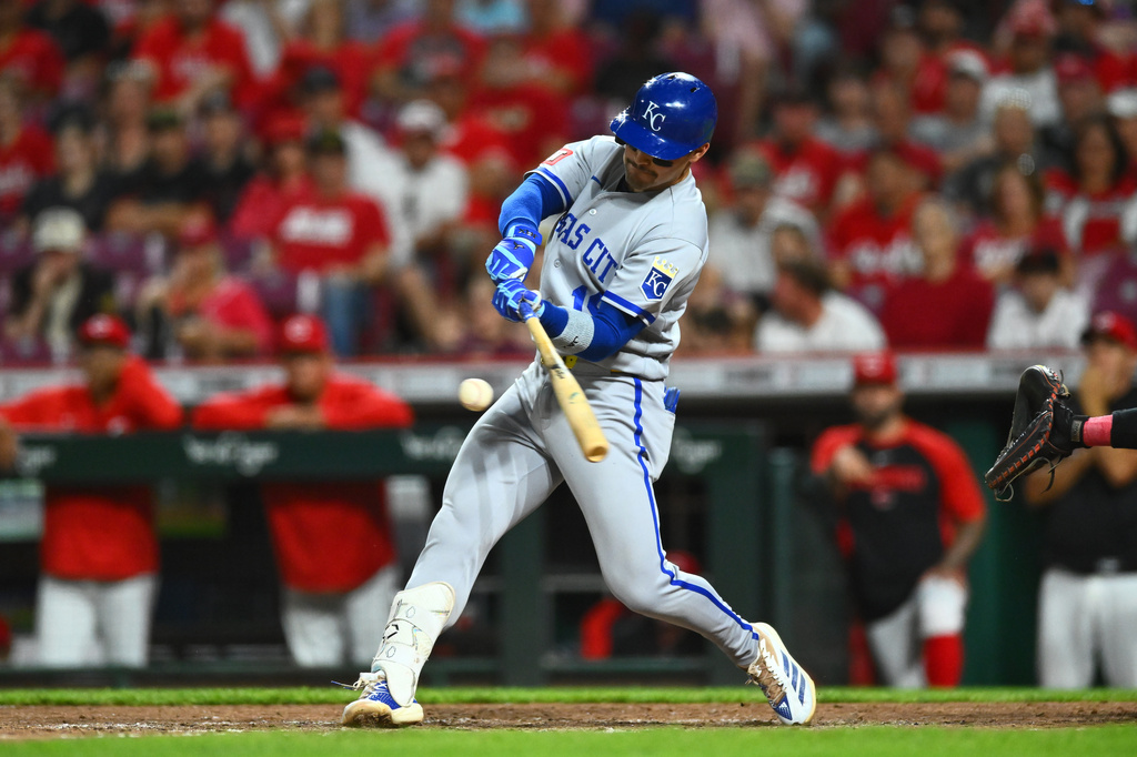 Kansas City Royals' Michael Massey (19) hits an RBI single during the ninth inning of a baseball game against the Cincinnati Reds in Cincinnati, Wednesday, June 3, 2026. (AP Photo/Ben Jackson)