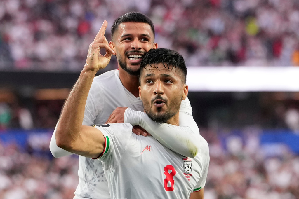 Iran's Mohammad Mohebbi (8) celebrates after scoring his side's second goal alongside Mehdi Ghayedi (10) during the World Cup Group G soccer match between Iran and New Zealand in Inglewood, Calif., near Los Angeles, Monday, June 15, 2026. (AP Photo/Mark J. Terrill)