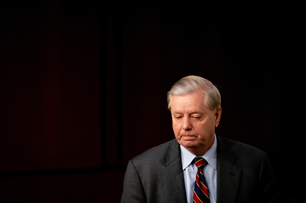 FILE - Sen. Lindsey Graham, R-S.C., returns to the room for the confirmation hearing for Supreme Court nominee Amy Coney Barrett, before the Senate Judiciary Committee, Tuesday, Oct. 13, 2020, on Capitol Hill in Washington. (Erin Schaff/The New York Times via AP, Pool, File)