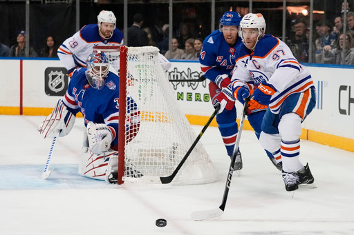 New York Rangers goaltender Igor Shesterkin (31) watches as Edmonton Oilers' Connor McDavid (97) looks to pass during the first period of an NHL hockey game Tuesday, Oct. 14, 2025, in New York. (AP Photo/Frank Franklin II) New York Rangers goaltender Igor Shesterkin (31) watches as Edmonton Oilers' Connor McDavid (97) looks to pass during the first period of an NHL hockey game Tuesday, Oct. 14, 2025, in New York. (AP Photo/Frank Franklin II)