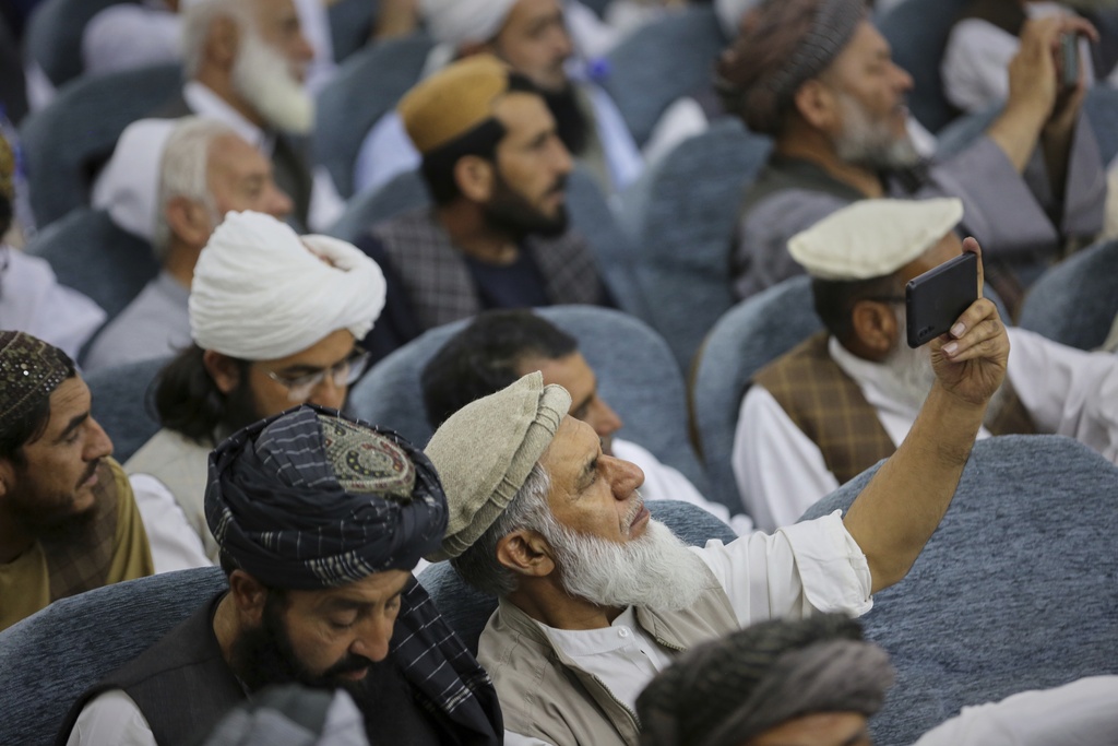 Taliban delegates from across the country gather during a meeting that opens celebrations marking the fourth anniversary of the U.S. withdrawal and the start of Taliban rule, at the Loya Jirga Hall in Kabul, Afghanistan, Friday, Aug. 15, 2025. (AP Photo/Siddiqullah Alizai)