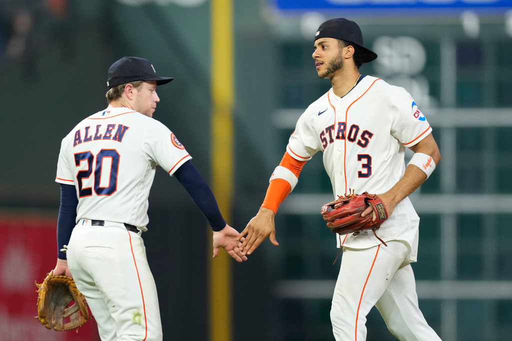Houston Astros' Jeremy Peña (3) and Nick Allen (20) celebrate after a baseball game against the Kansas City Royals Thursday, Sept. 17, 2026, in Houston. (AP Photo/David J. Phillip)