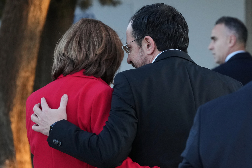 Cyprus' President Nikos Christodoulides, right, talks with the U.N the Personal Envoy of U.N Secretary General Maria Angela Holguin before a meeting, at the U.N compound inside the UN buffer zone in divided capital Nicosia, Cyprus, Thursday, Dec. 11. 2025. (AP Photo/Petros Karadjias)
